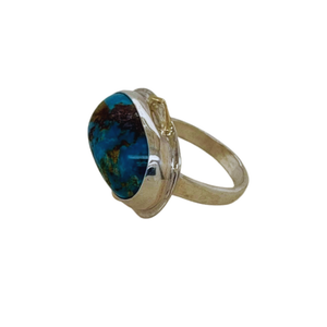 Persian Turquoise ring set in sterling silver with small 14K yellow gold accents.