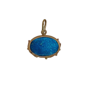 Persian Turquoise pendant set in sterling silver with 14k yellow gold accents.