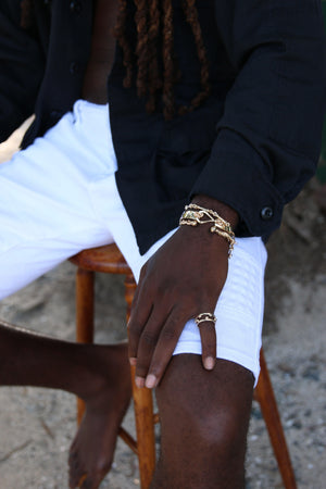 Gold bamboo bracelet.