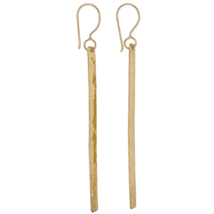 Long stick earrings in gold.