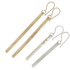 Long stick earrings in gold and sterling silver.