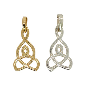 Intricate pendant in gold and sterling silver.