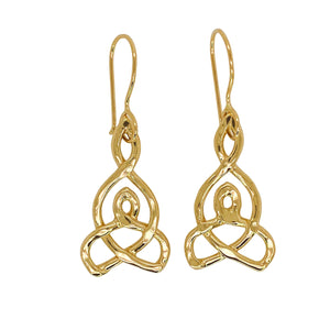 Intricate earrings in gold.