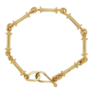 Gold bamboo bracelet.