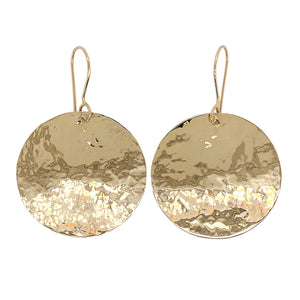 Hammered disc earrings in 14 kt gold.