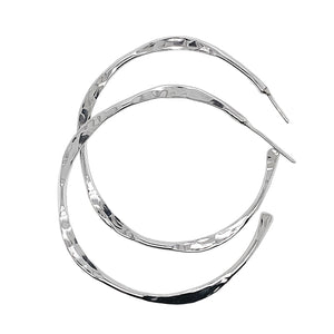 Hammered silver hoop earrings in sterling sivler.