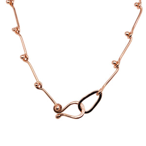Ball link necklace in 14 kt rose gold.