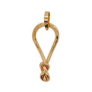 Infinity knot pendant in gold.
