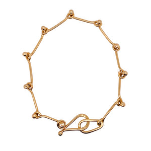 Ball link bracelet in 14 kt gold.