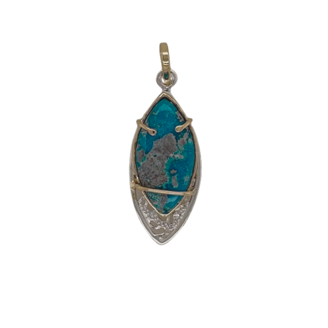 Persian Turquoise pendant set in sterling silver with 14k yellow gold bale and prongs.