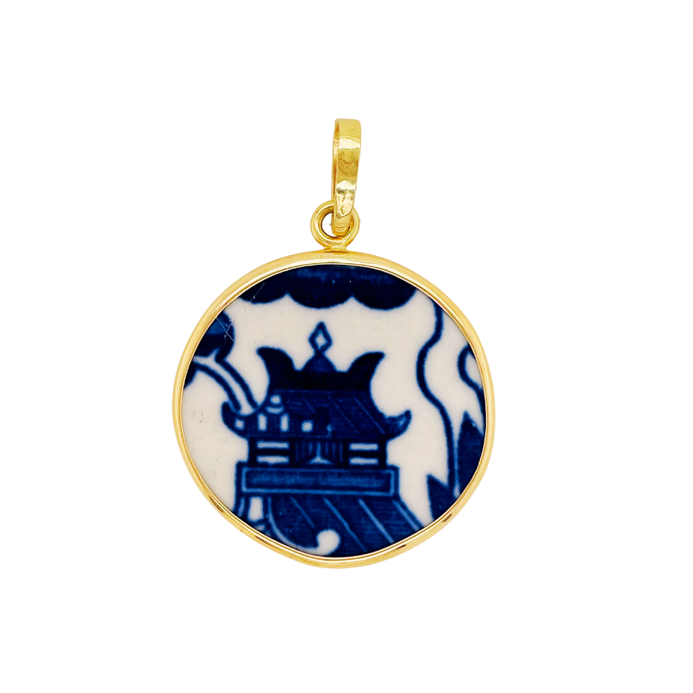 14k yellow gold blue chaney pendant.