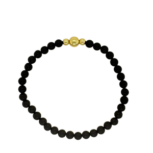Matte Onyx hand beaded bracelet with gold fill beads.