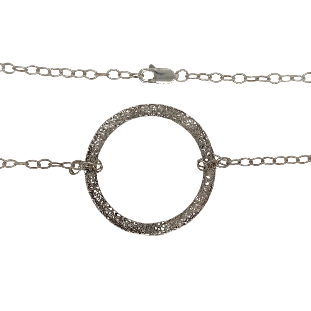 Sterling silver hammered circle necklace.