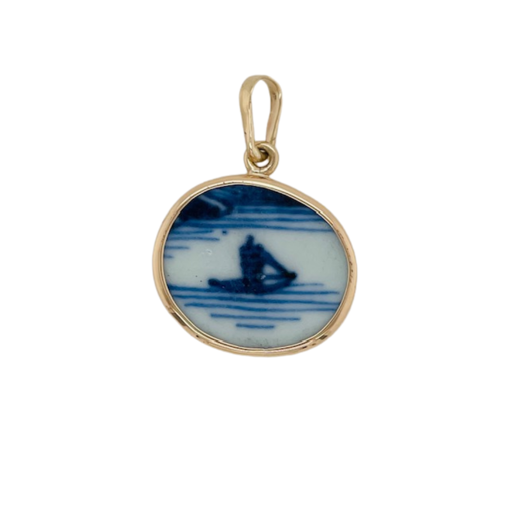 14k yellow gold blue Chaney pendant.