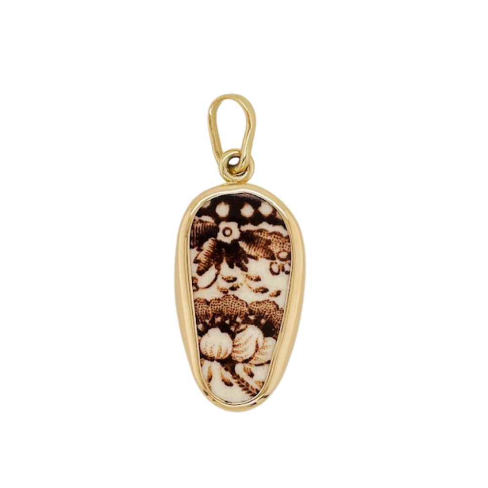 14k yellow gold brown Chaney pendant.