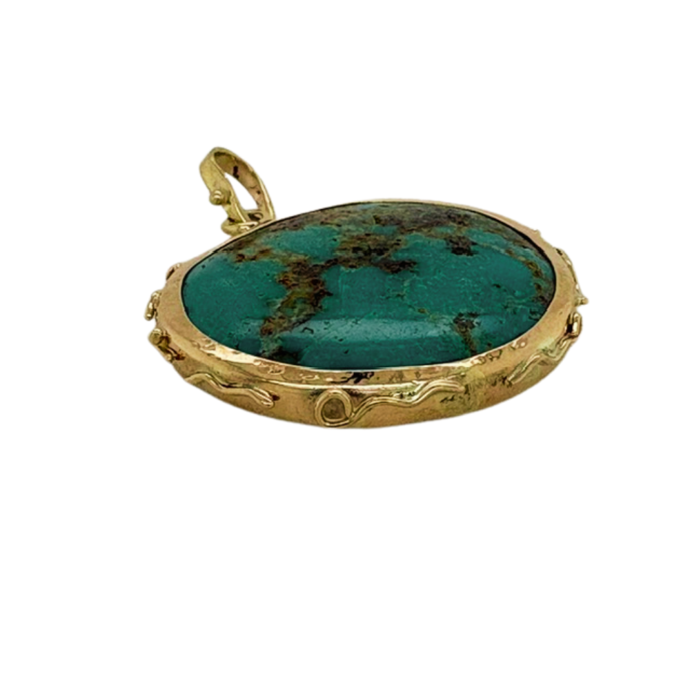 Persian Turquoise pendant set in 14K Yellow Gold.