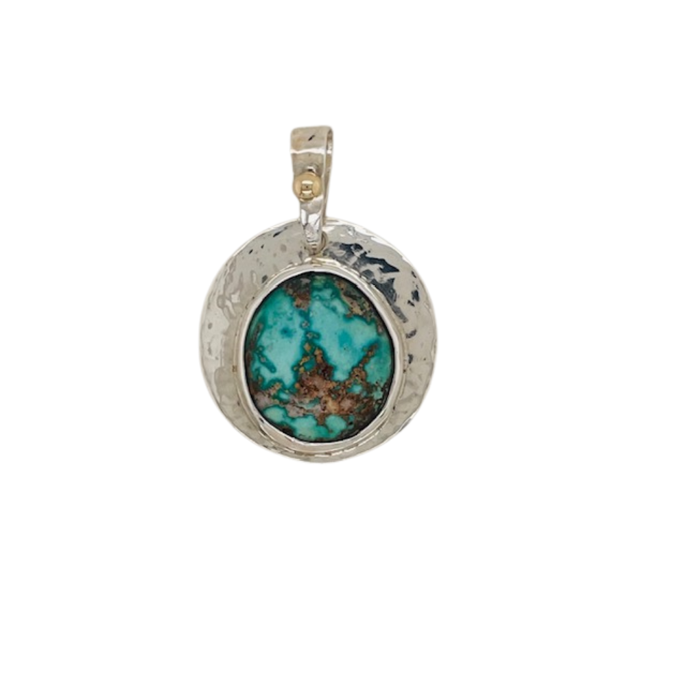 Persian Turquoise pendant set in sterling silver with a 14k yellow gold accent.