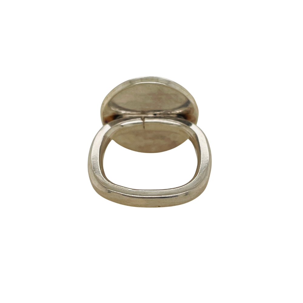 Band shape of round Persian Turquoise ring set in sterling silver.