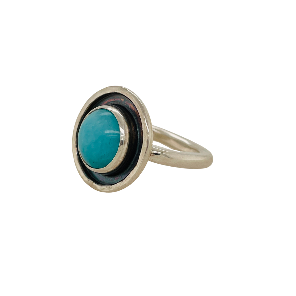 Sideview round Persian Turquoise ring set in sterling silver.