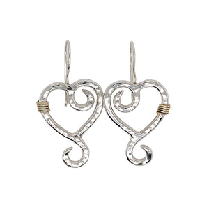 Heart shaped dangle earrings in sterling silver.