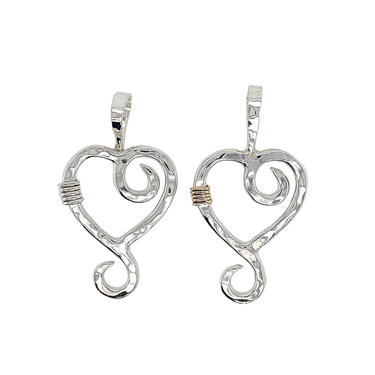 Hammered heart pendant in sterling silver.