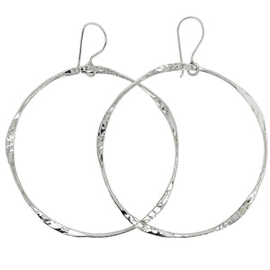 Hammered hoop earrings in sterling silver.