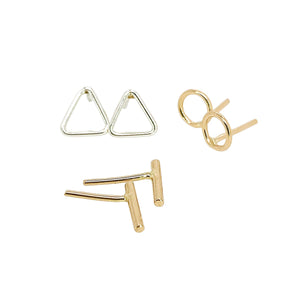 Geometric stud earrings in sterling silver and gold. 