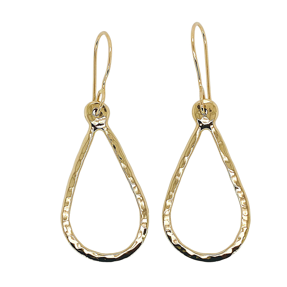 Hammered teardrop earrings in gold.