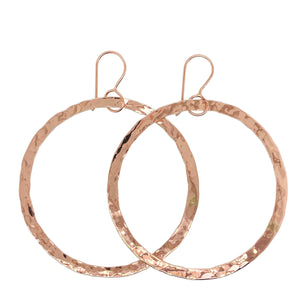 Circle of life earrings in rose gold.