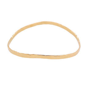 Hammered bangle in yellow gold