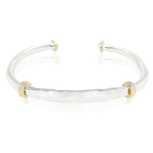 Caribbean-made hammered bridge cuff bracelet in sterling silver and sterling silver with gold accents. 