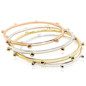 Dreamcatcher bangle in rose gold, sterling silver and gold.