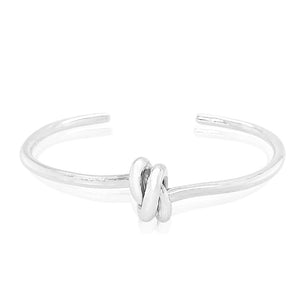Double love knot cuff bracelet in sterling silver.